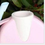 Arrosoir en teintes pastel pour un jardin stylé