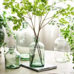 Dame Jeanne en verre vert pour fleurs