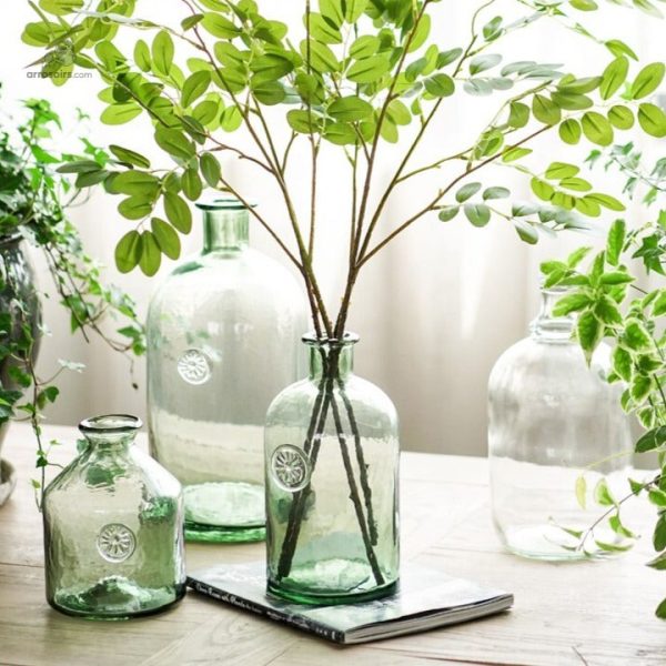 Dame Jeanne en verre vert pour fleurs